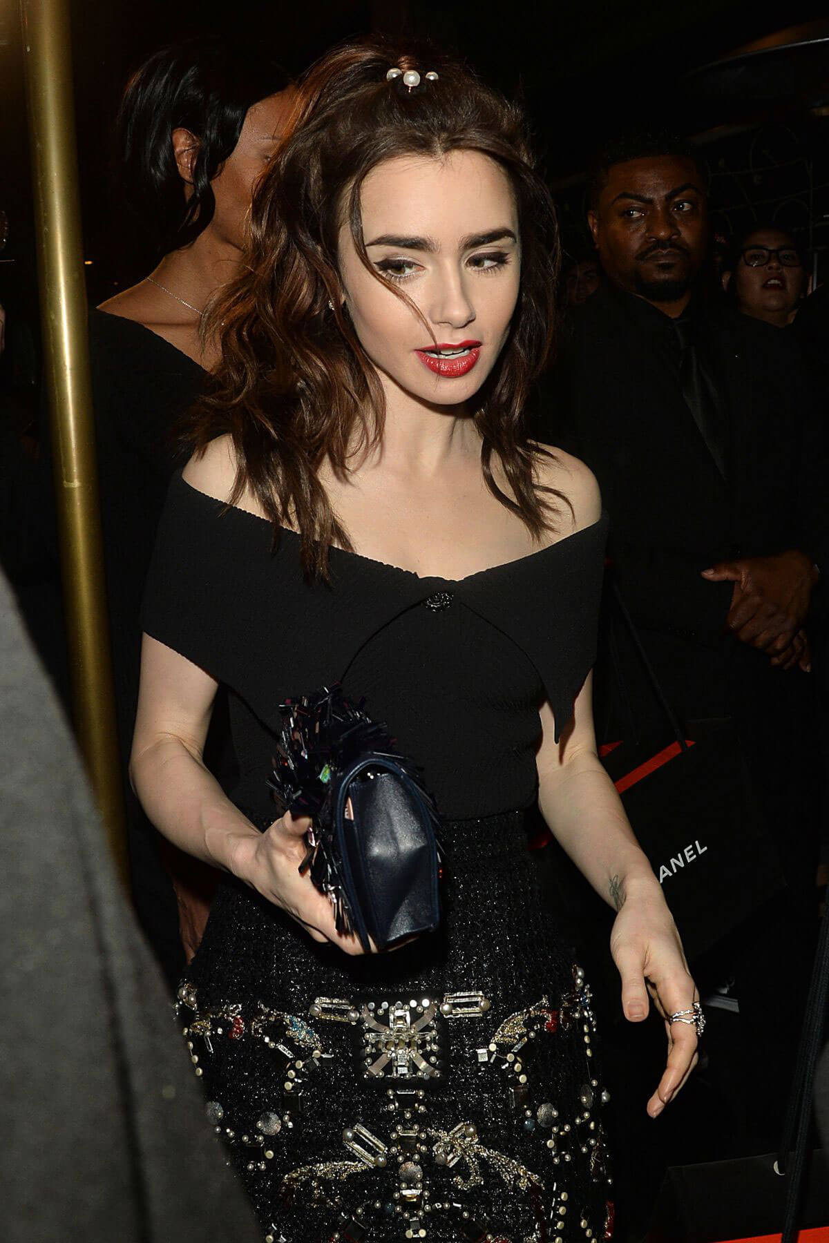 Lily Collins Stills Leaves Charles Finch and Chanel Pre Oscar Awards Dinner in Beverly Hills