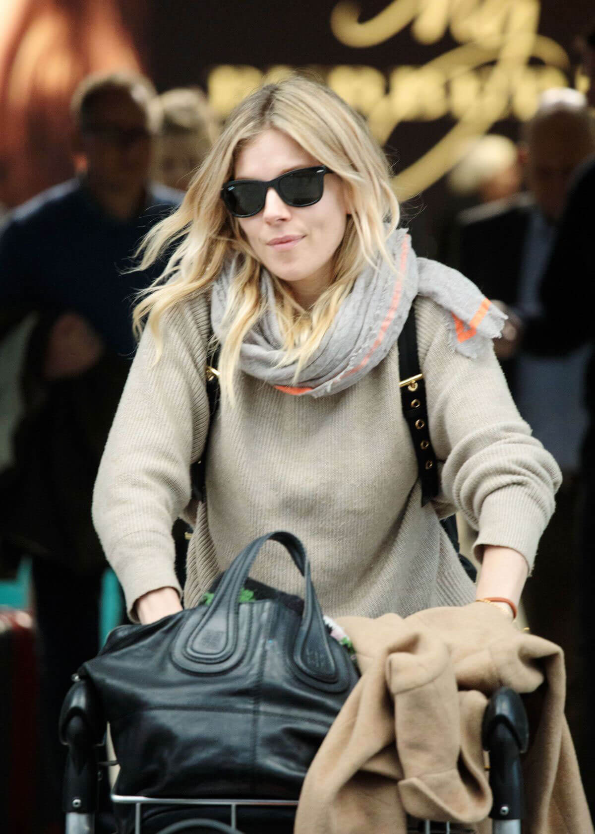 Sienna Miller Stills at Heathrow Airport in London