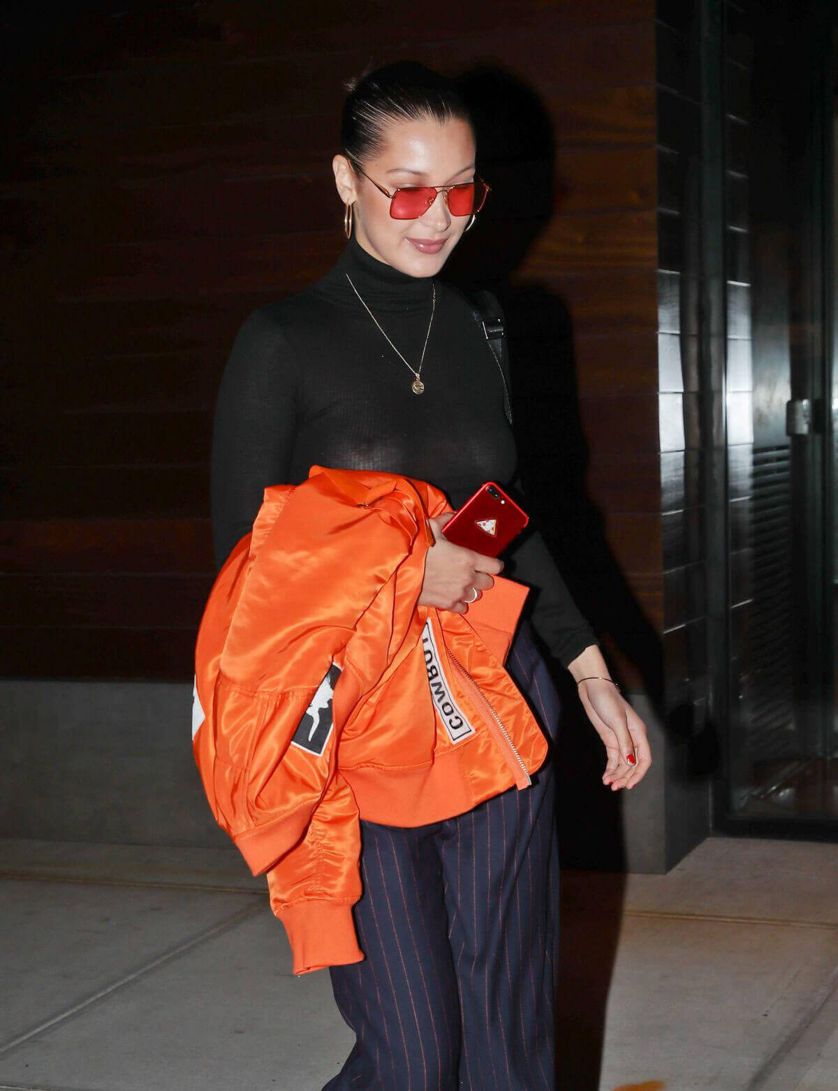 Bella Hadid wearing transparent black top in New York