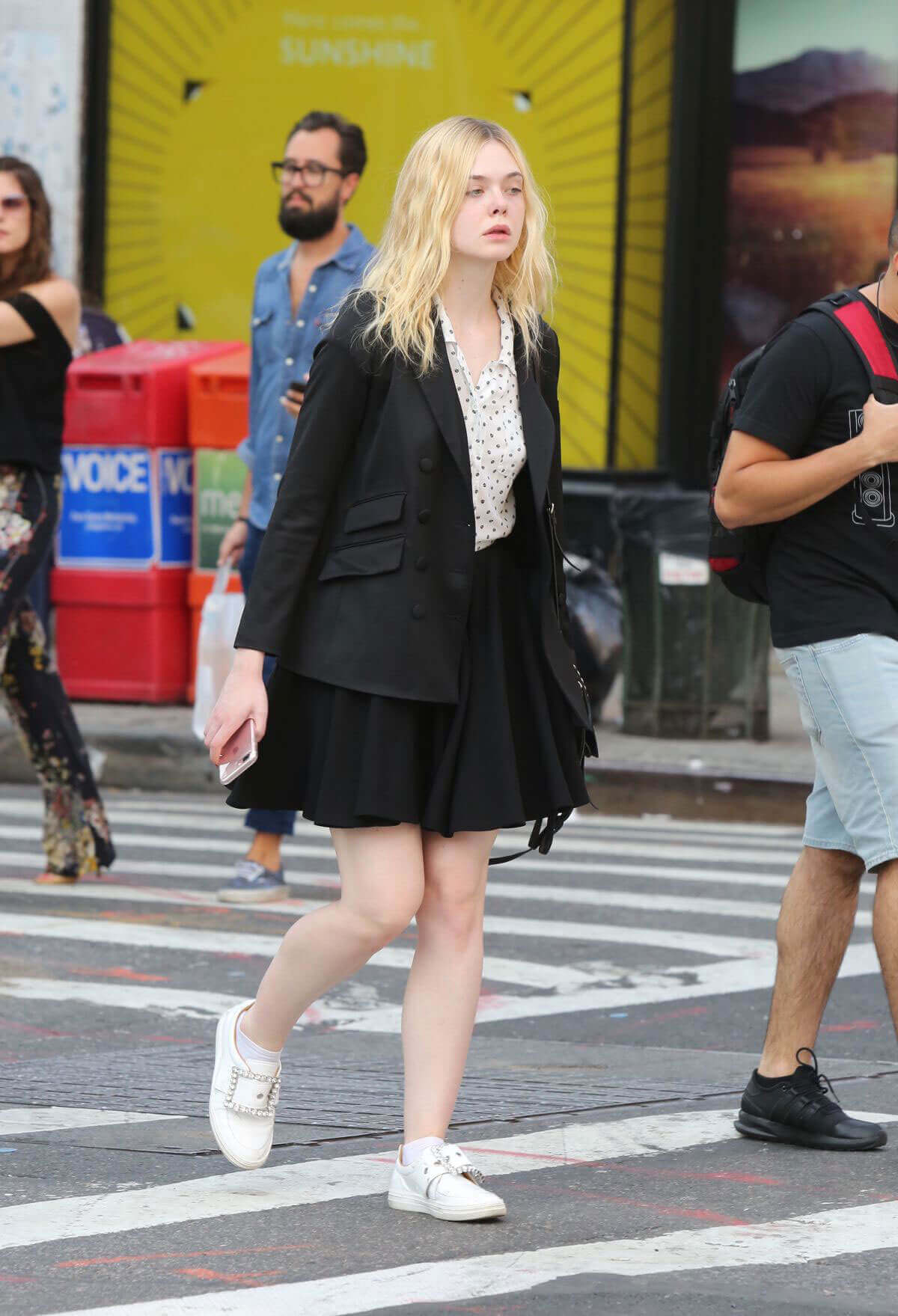 Elle Fanning wears short skirts shows off legs out and about in New York