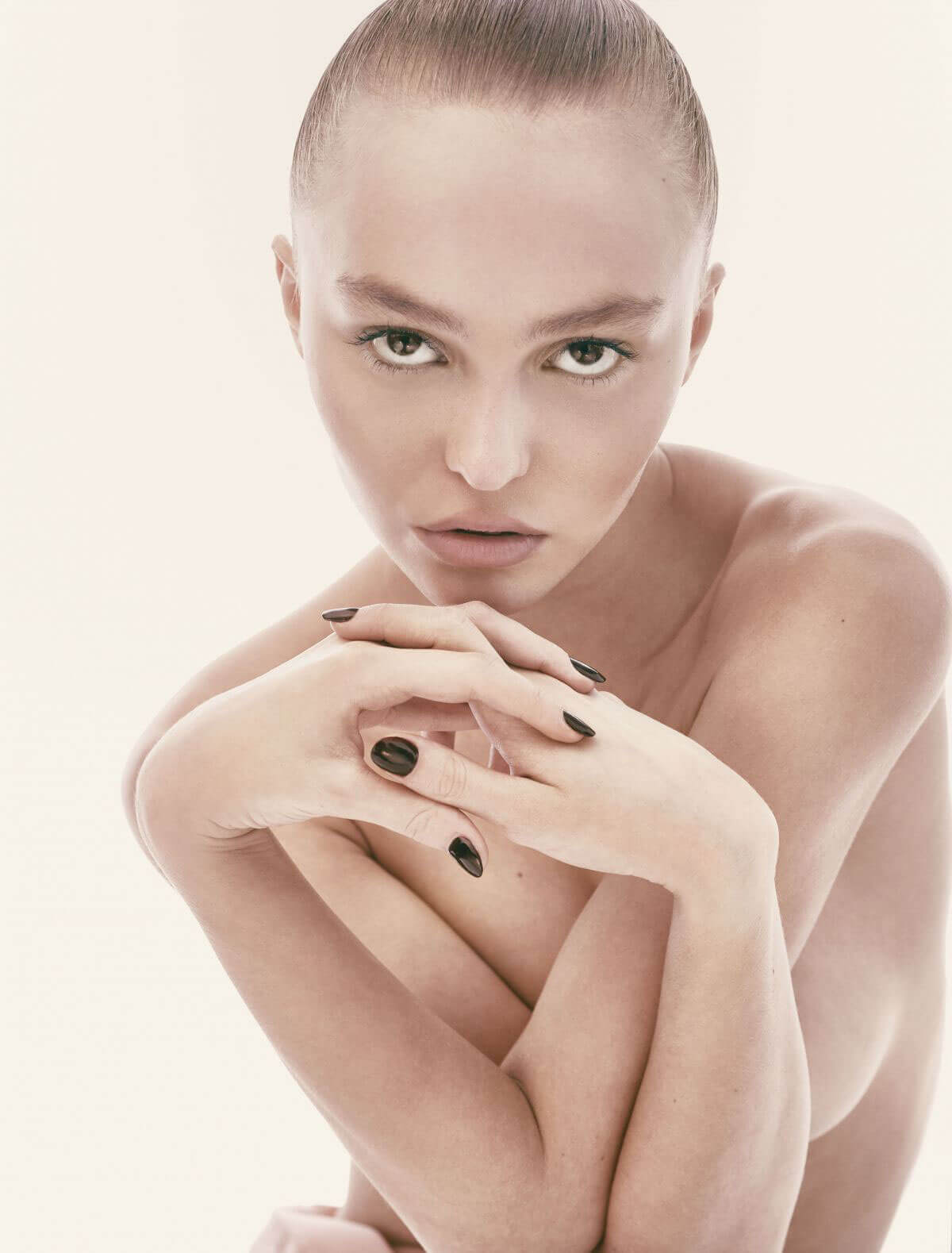Lily-Rose Depp Stills Poses Topless for "CR Fashion Book" Photos