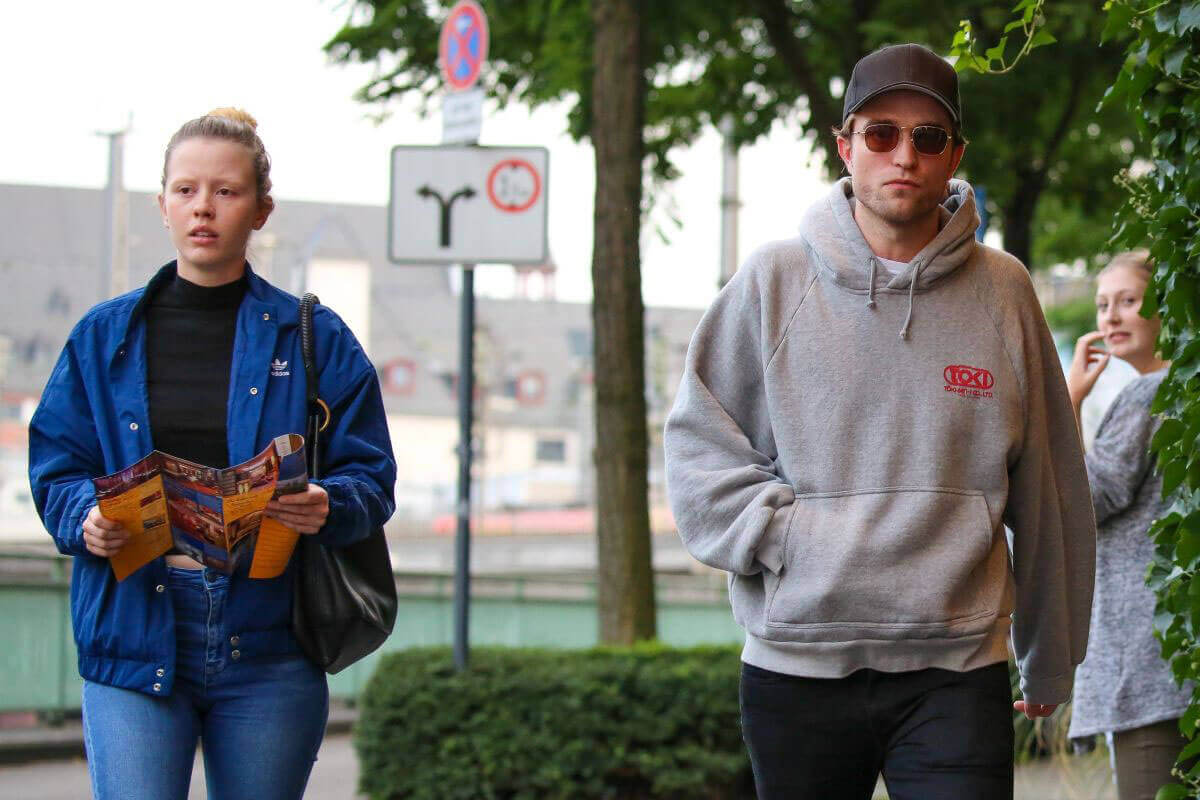 Mia Goth and Robert Pattinson Stills Out in Cologne Photos