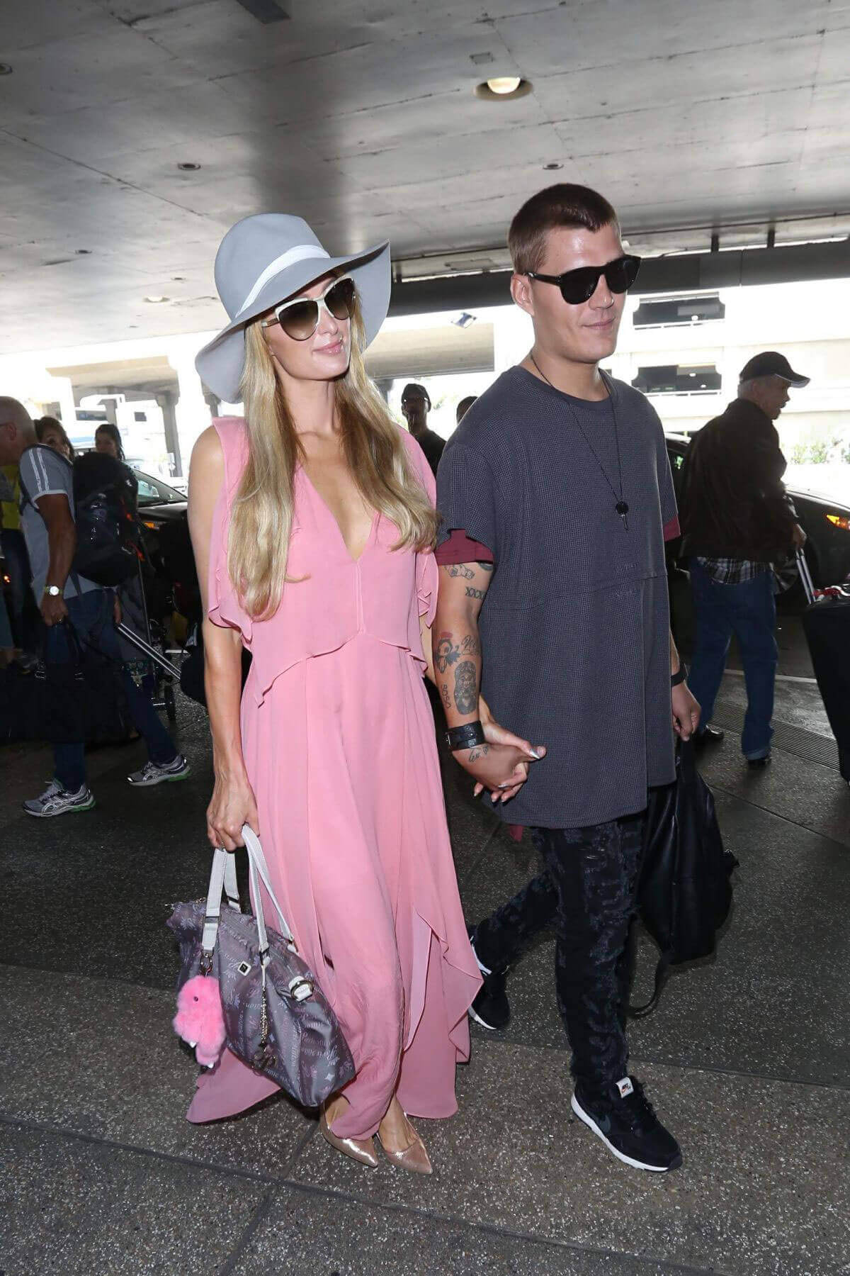 Paris Hilton and Her Boyfriend Chris Zylka Hold Hands at LAX Airport in Los Angeles