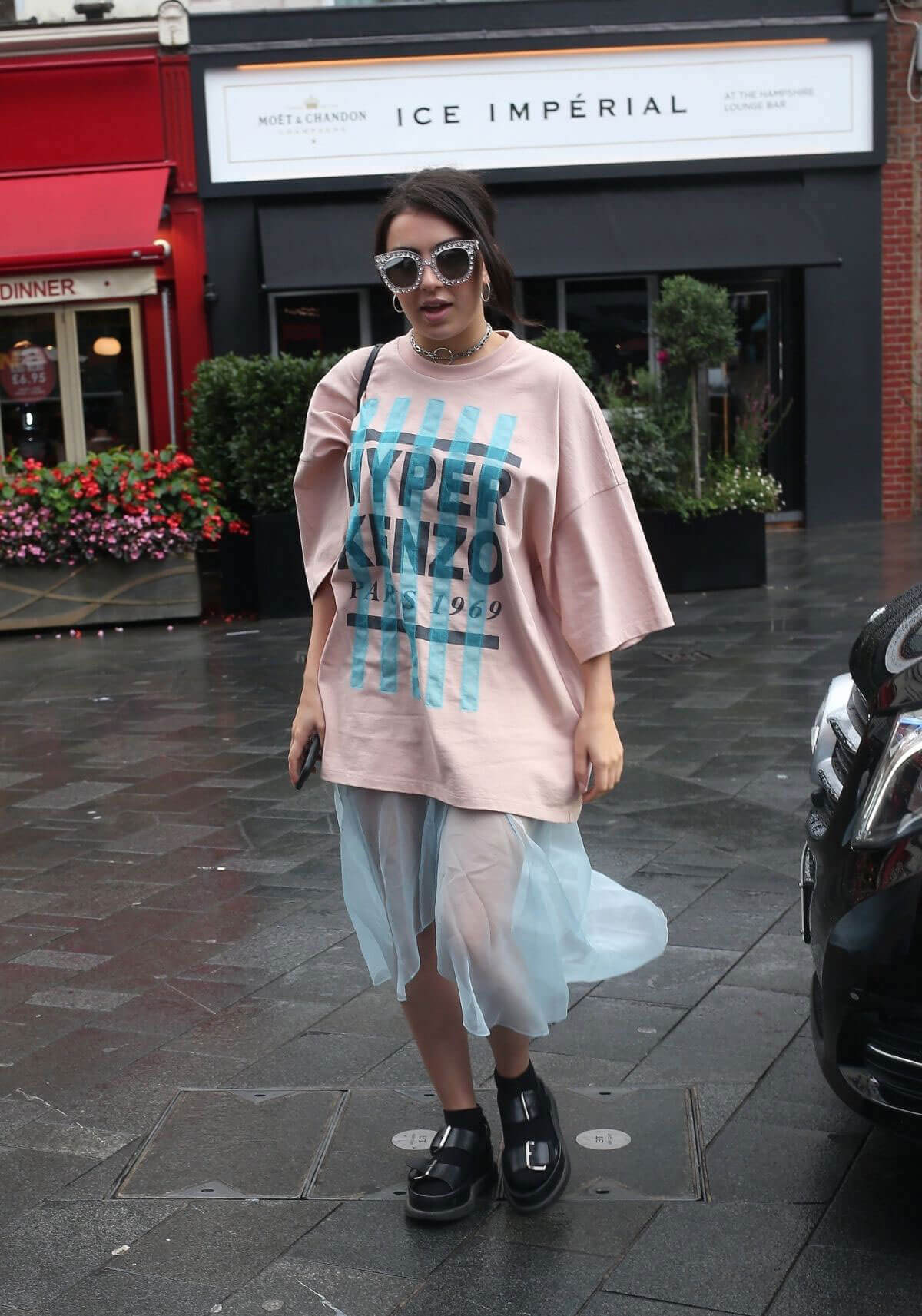 Charli XCX flaunts her legs in transparent bottom arrives at global radio in London