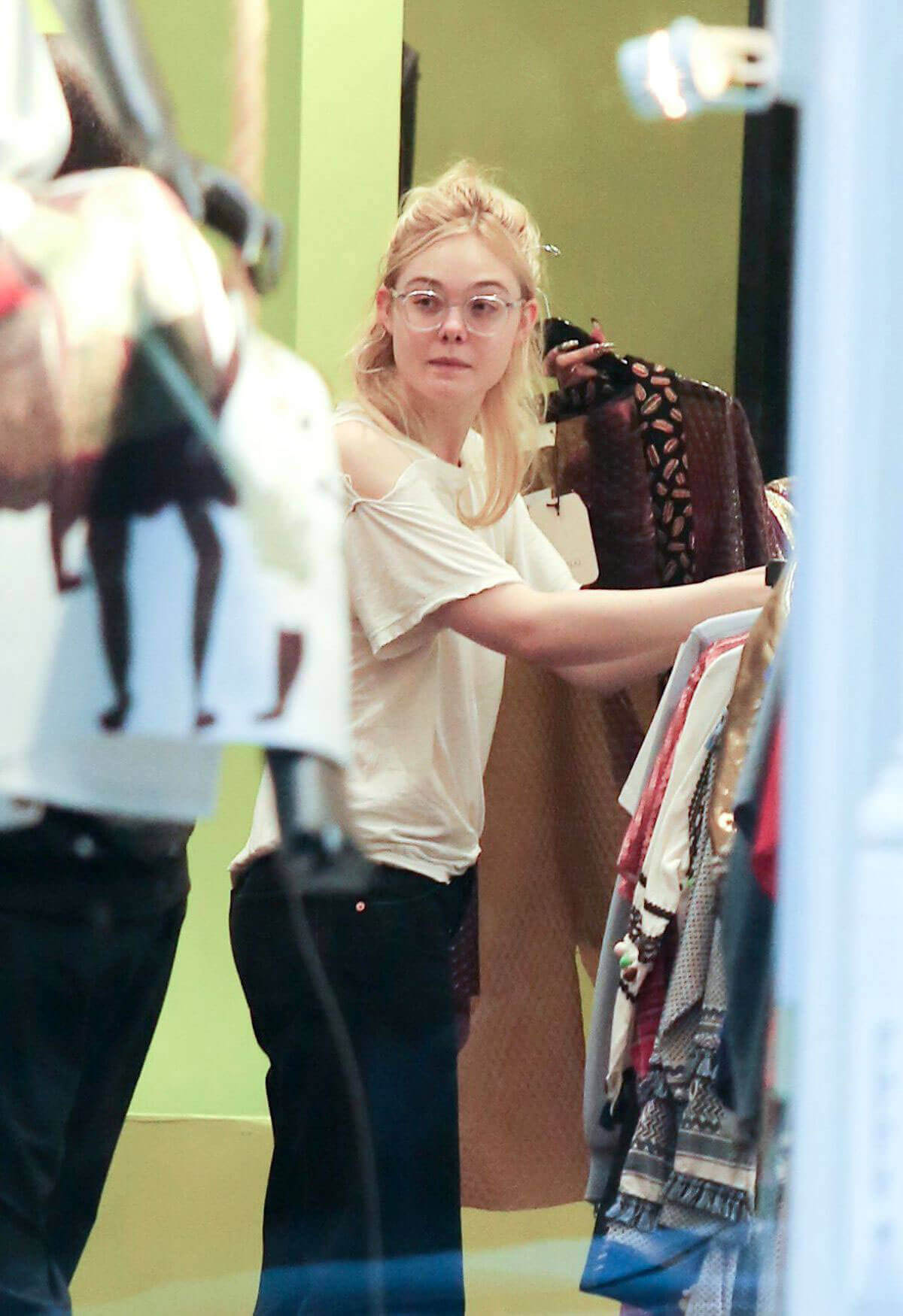 Elle Fanning Stills Shopping in New York Photos