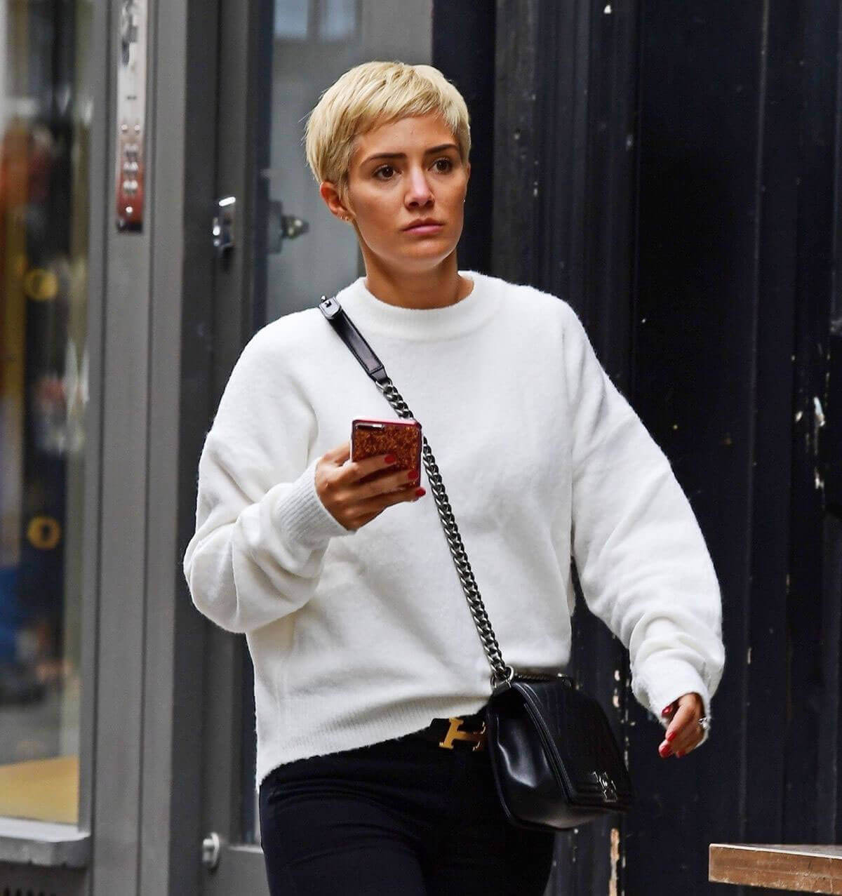 Frankie Bridge wears Slogan Sweater Out and About in London