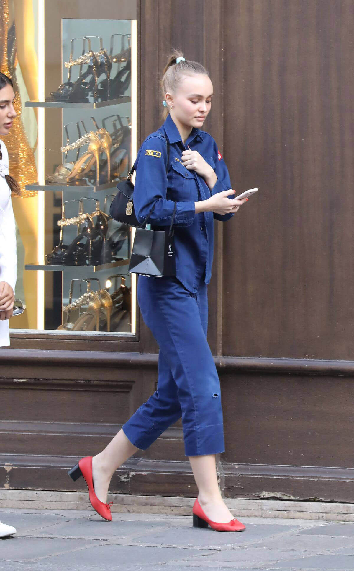 Lily-Rose Depp wears blue boiler suit during shopping in Paris