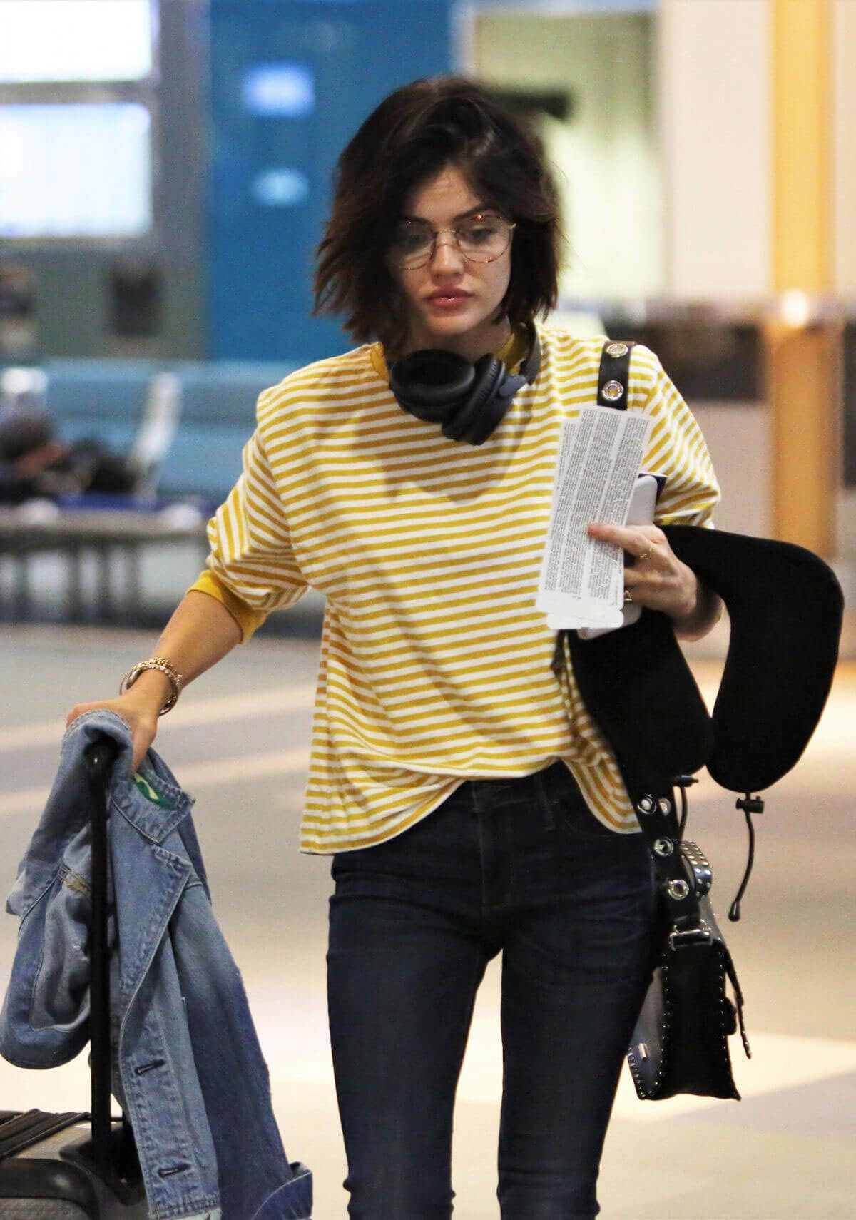 Lucy Hale wears Yellow Striped Top at Airport in Vancouver