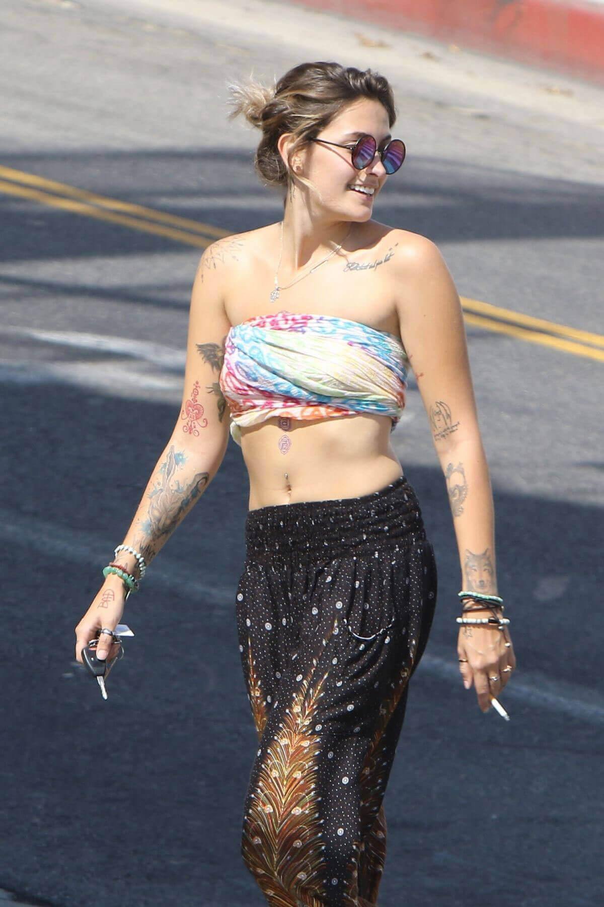 Paris Jackson shows off belly button at Tattoo Mania in West Hollywood