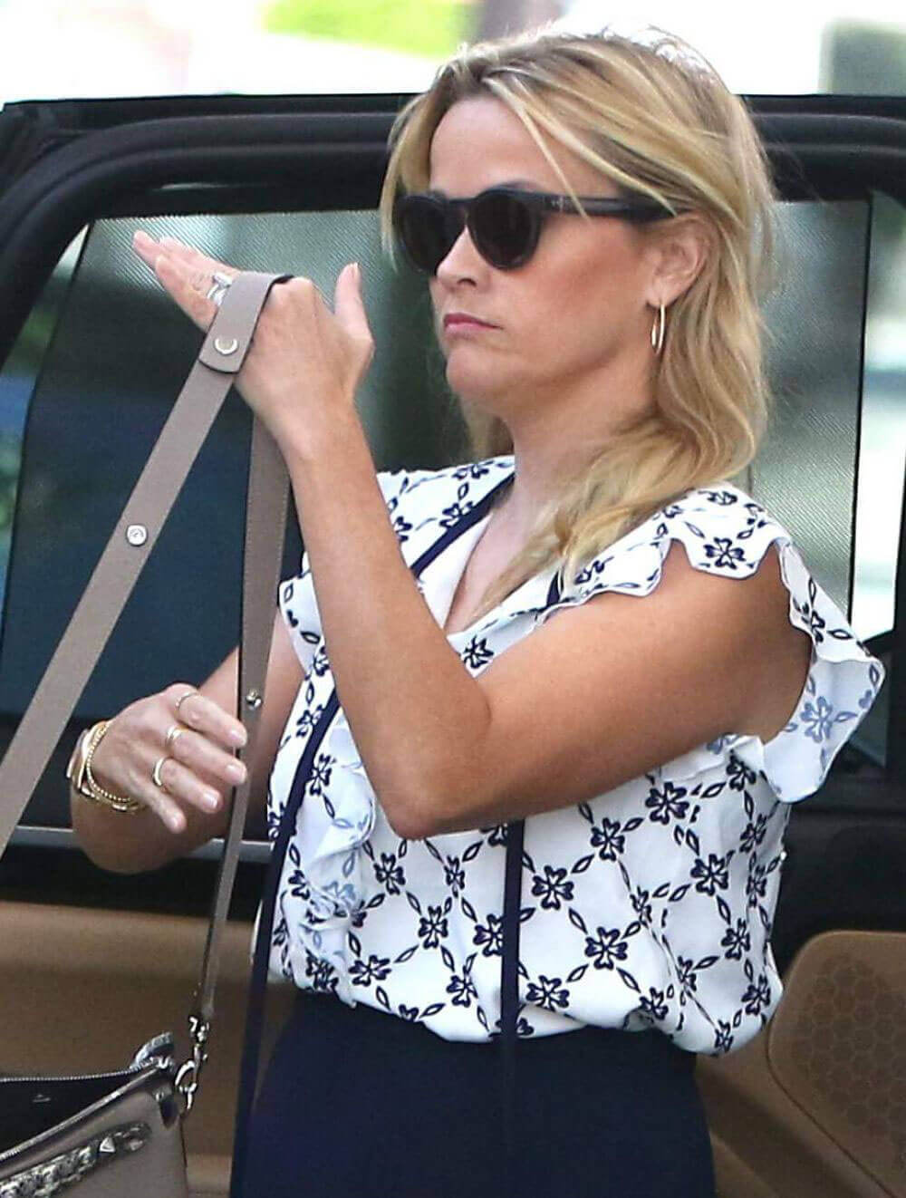 Reese Witherspoon displays legs in navy skirt out and about in Beverly Hills