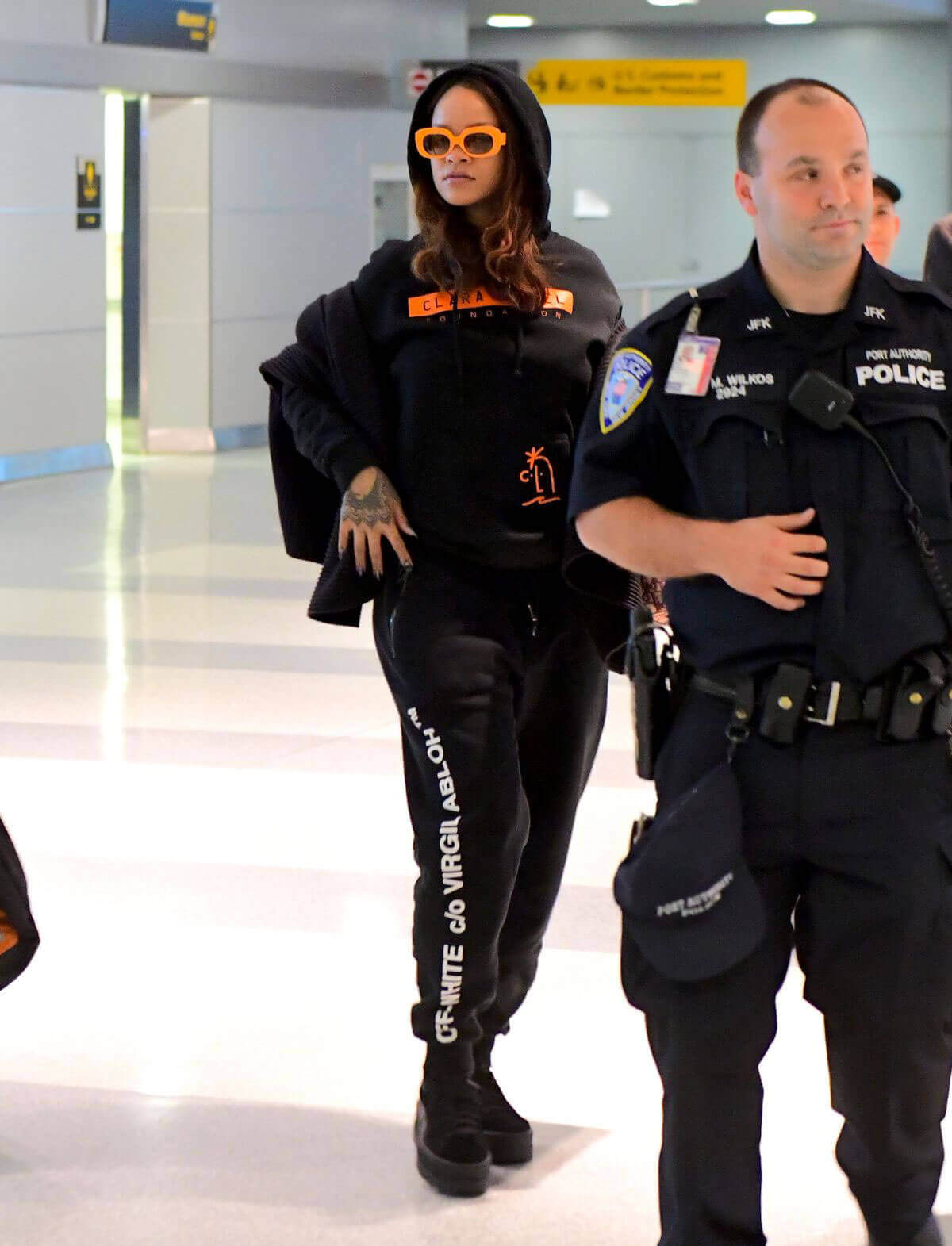 Rihanna wears Sweater Stills at JFK Airport in New York