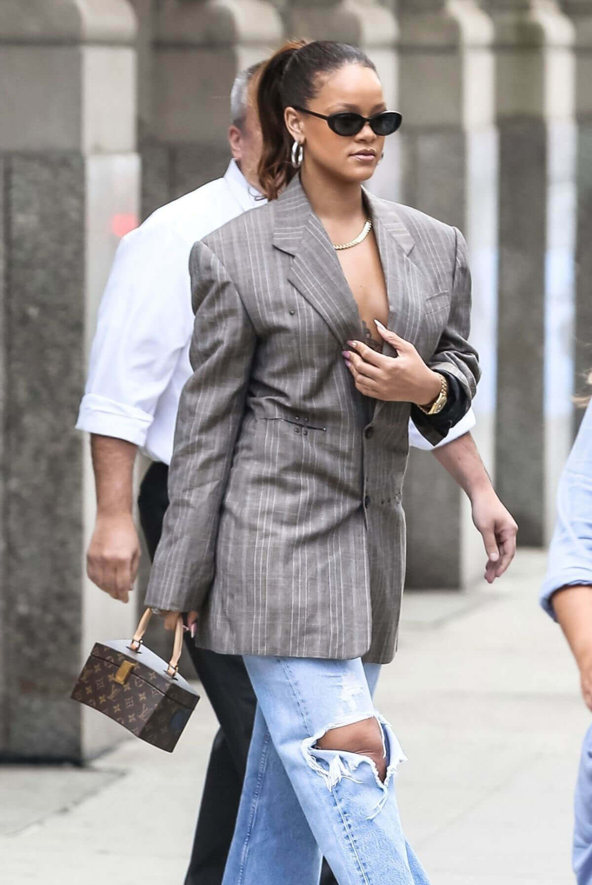 Rihanna without Bra wears Suit Heading to New York Fashion Week in New York