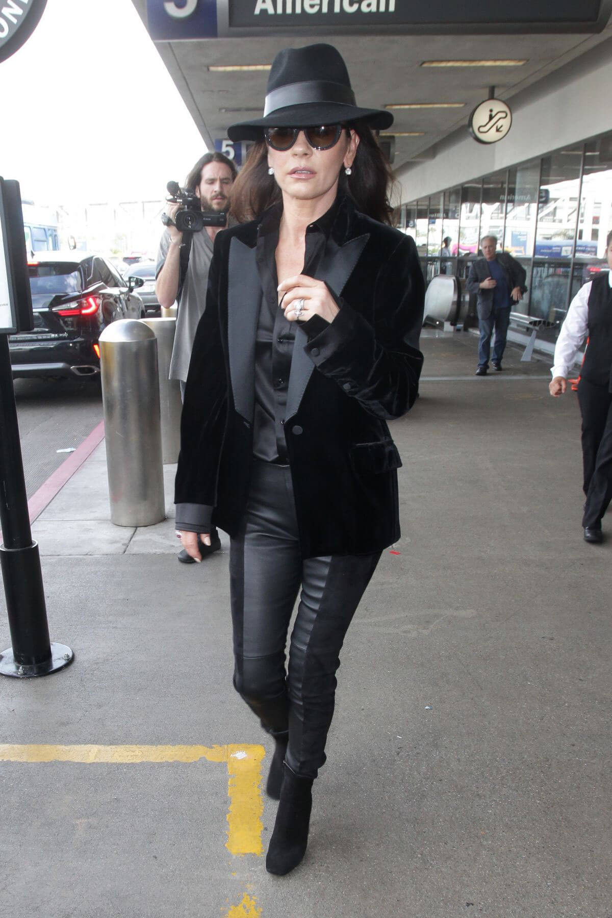 Catherine Zeta-Jones wears Black Dress with Black Hat at Los Angeles International Airport