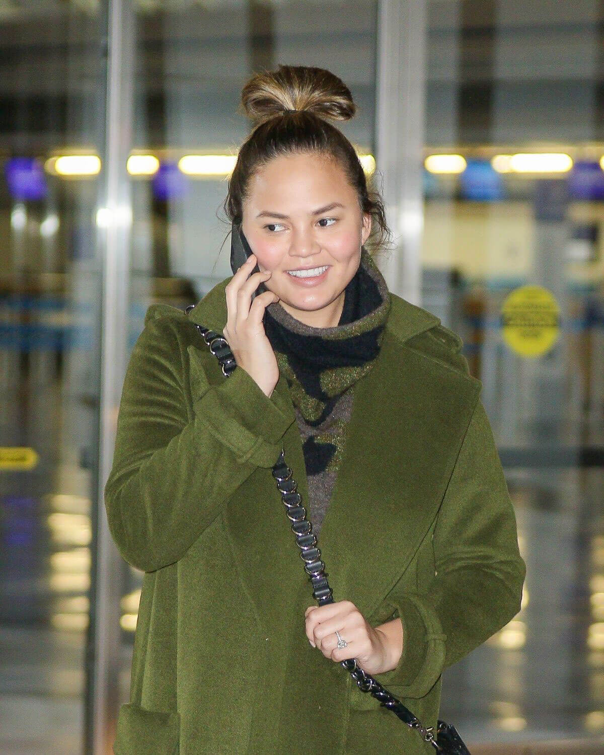 Chrissy Teigen Stills at Los Angeles International Airport Images