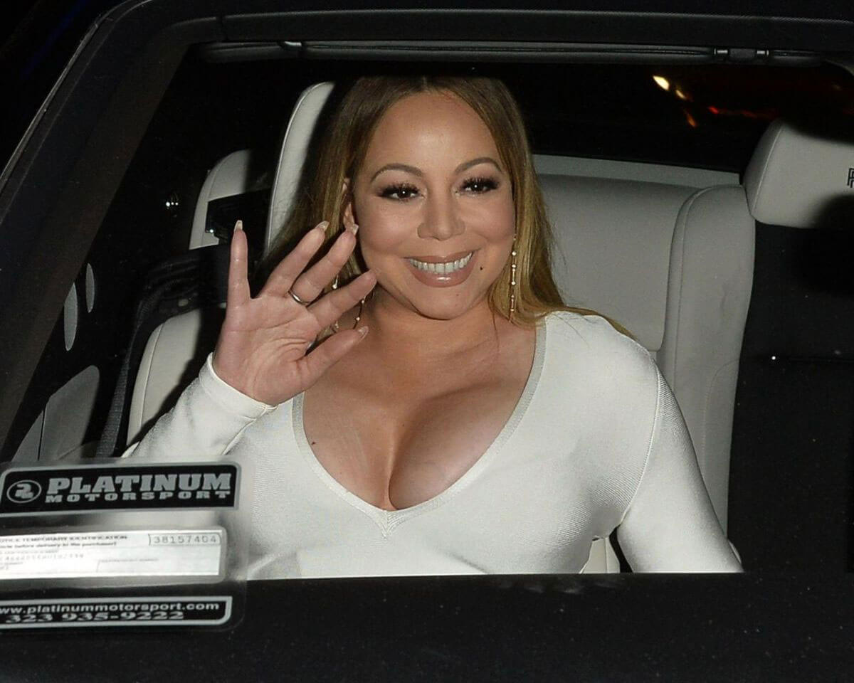 Mariah Carey shows off cleavage in White Dress Night Out in Los Angeles