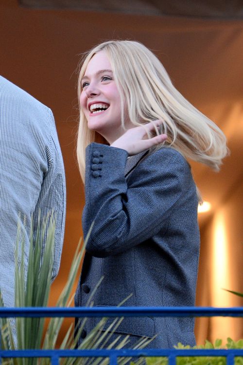 Elle Fanning at balcony of the Martinez Hotel in the evening of the Cannes Film Festival in France 2019/05/13 10