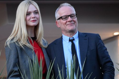 Elle Fanning at balcony of the Martinez Hotel in the evening of the Cannes Film Festival in France 2019/05/13 12