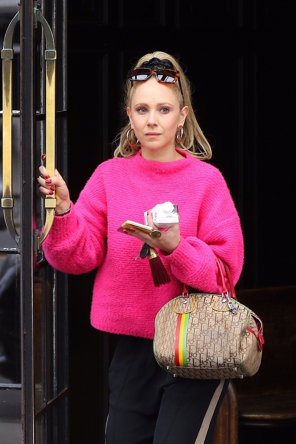 Juno Temple wearing Bright Pink Sweater in New York 2019/04/29