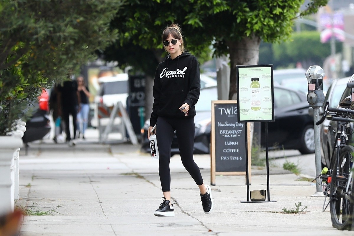 Dakota Johnson in Black Hoodies with Tights Leaves a Yoga Class in Los Angeles 2019/07/07