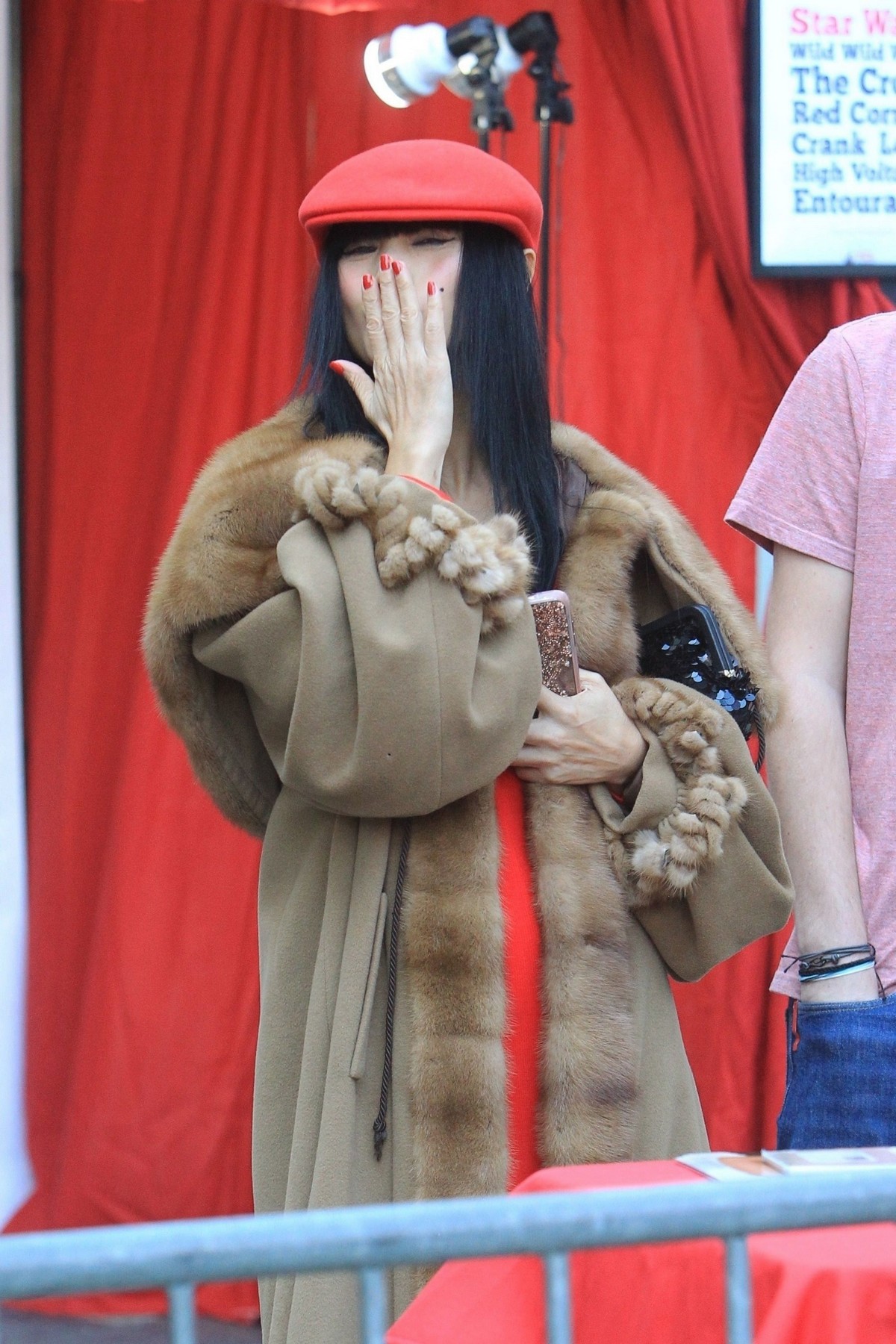 Bai Ling in red dress with cozy long coat at TCL Chinese Theater in Hollywood 2019/11/23