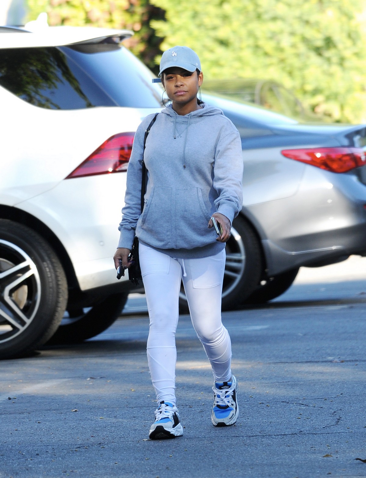 Christina Milian in grey hoddie with tights at her Beinet Box Truck in Los Angeles 2019/11/24