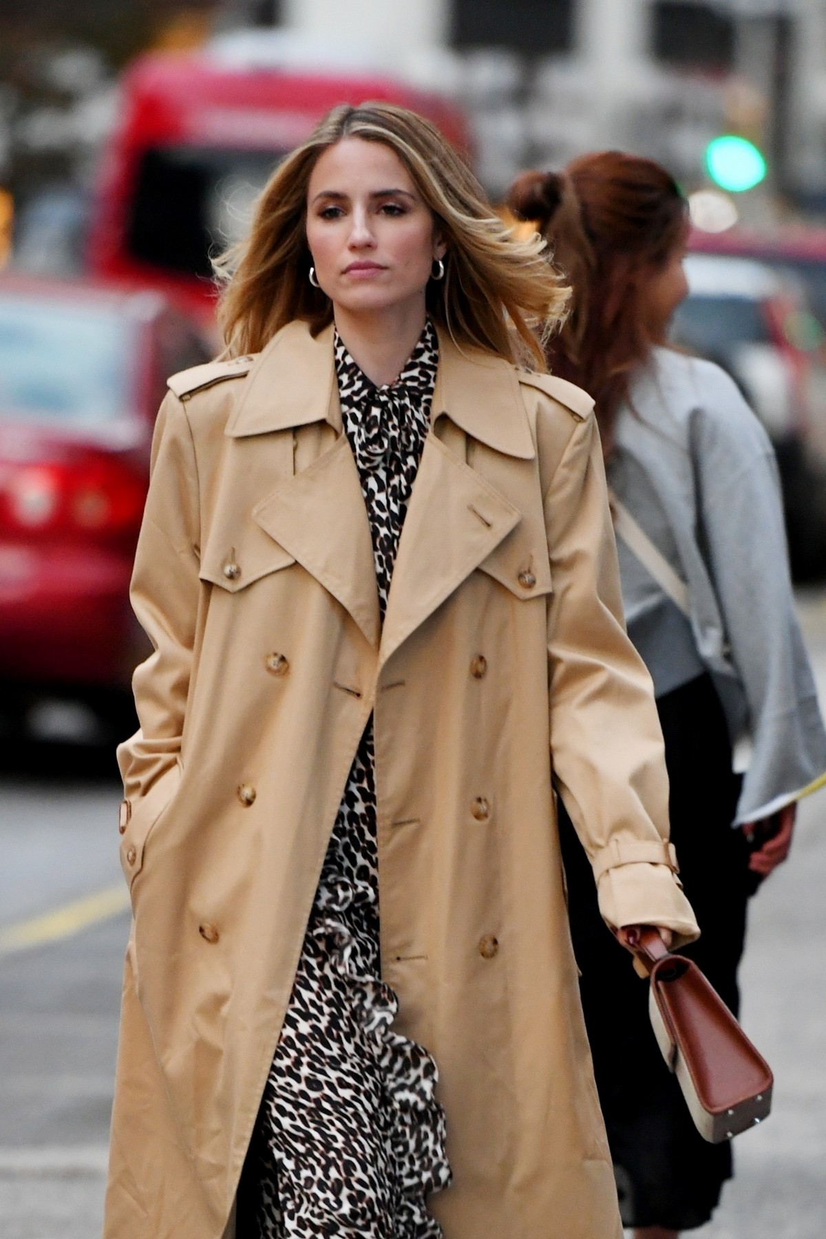 Dianna Agron wears a black and white patterned dress paired with a trench coat out in New York 2019/10/28