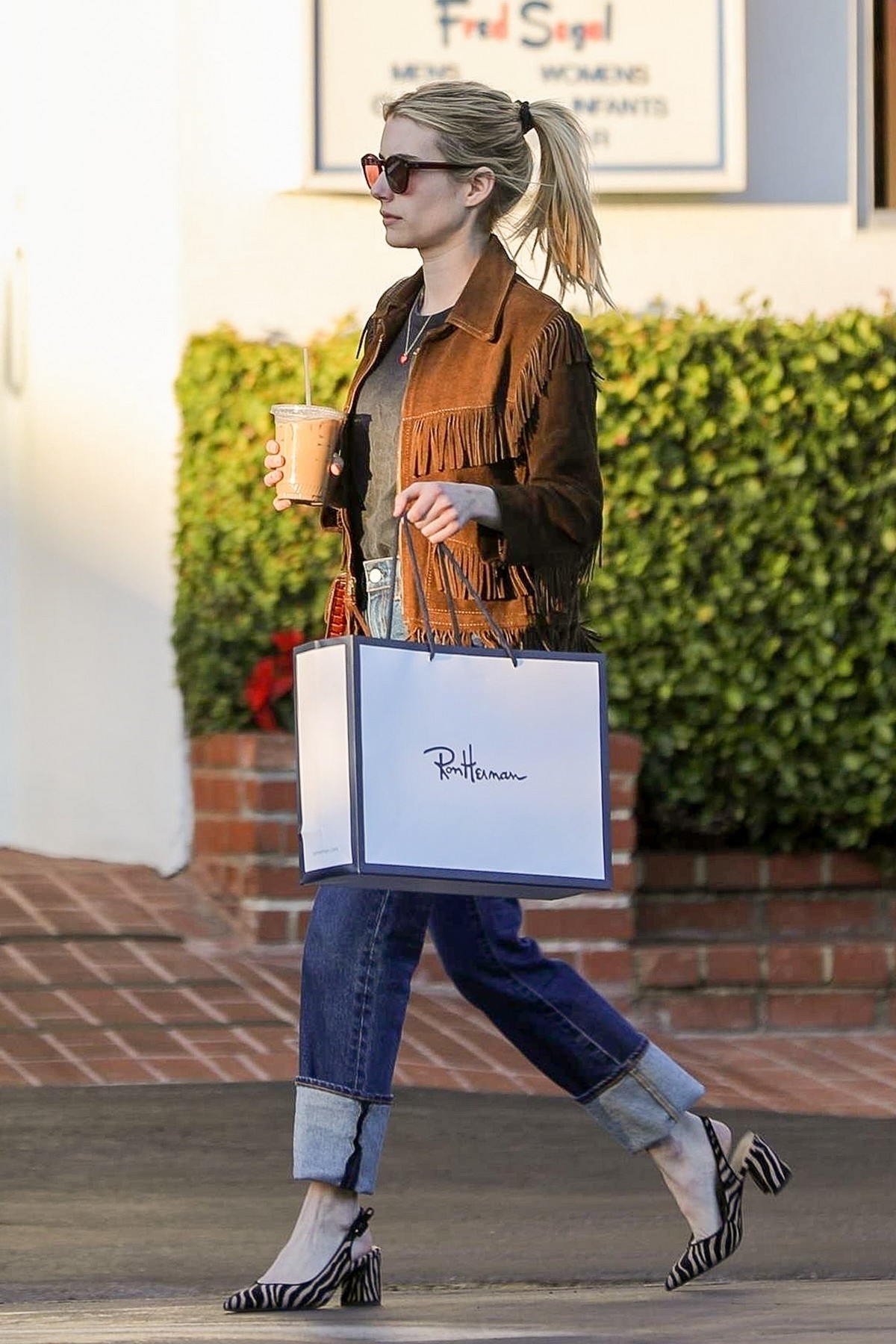 Emma Roberts in stylish brown jacket out shopping in Beverly Hills 2019/12/18