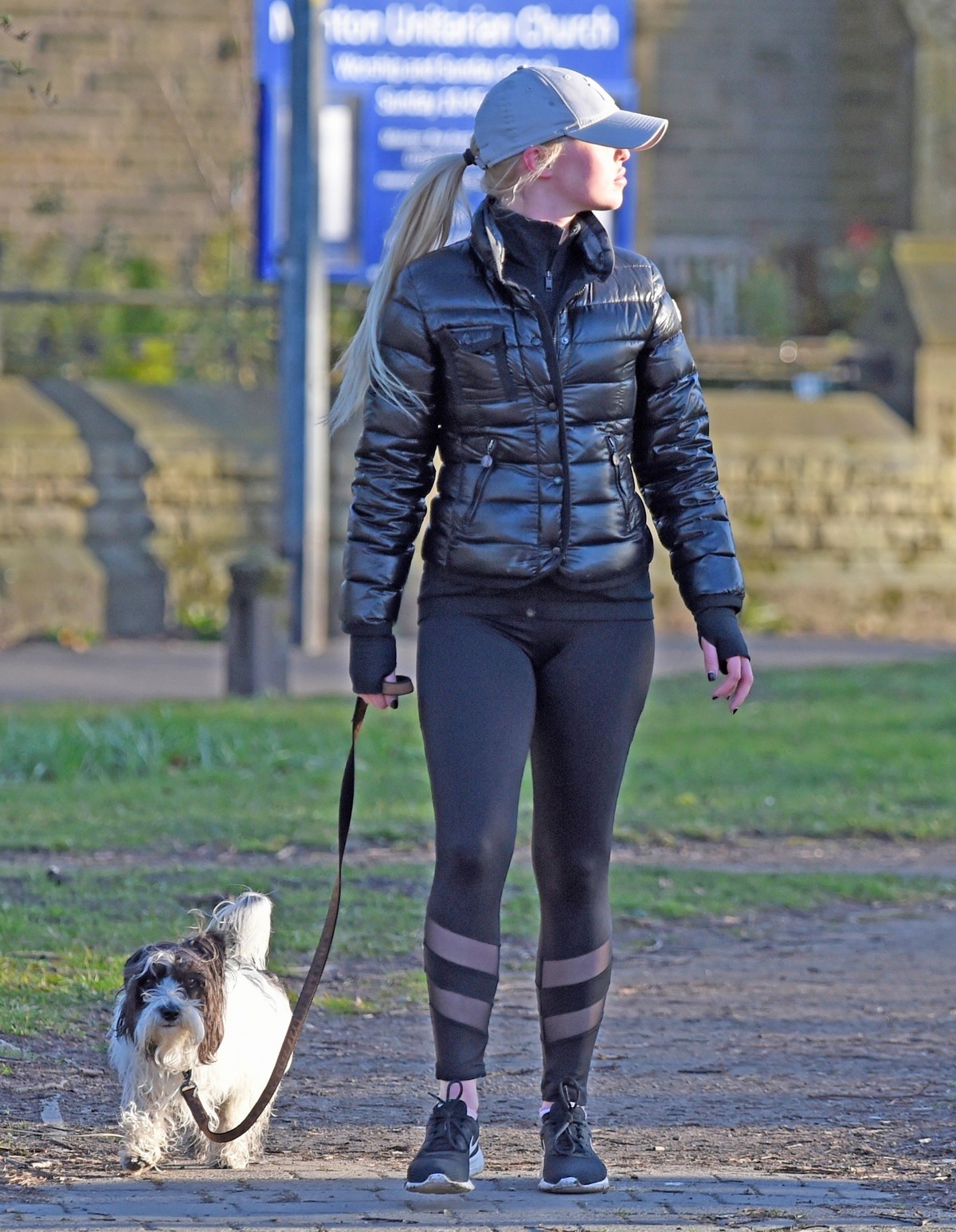 Jorgie Porter in puffer jacket and tights during jogging with her dog in Manchester 2020/03/29