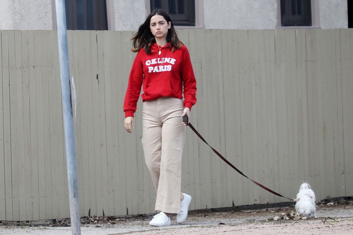 Ana De Armas seen in red sweatshirt during walk her dog out in Pacific Palisades 2020/04/11