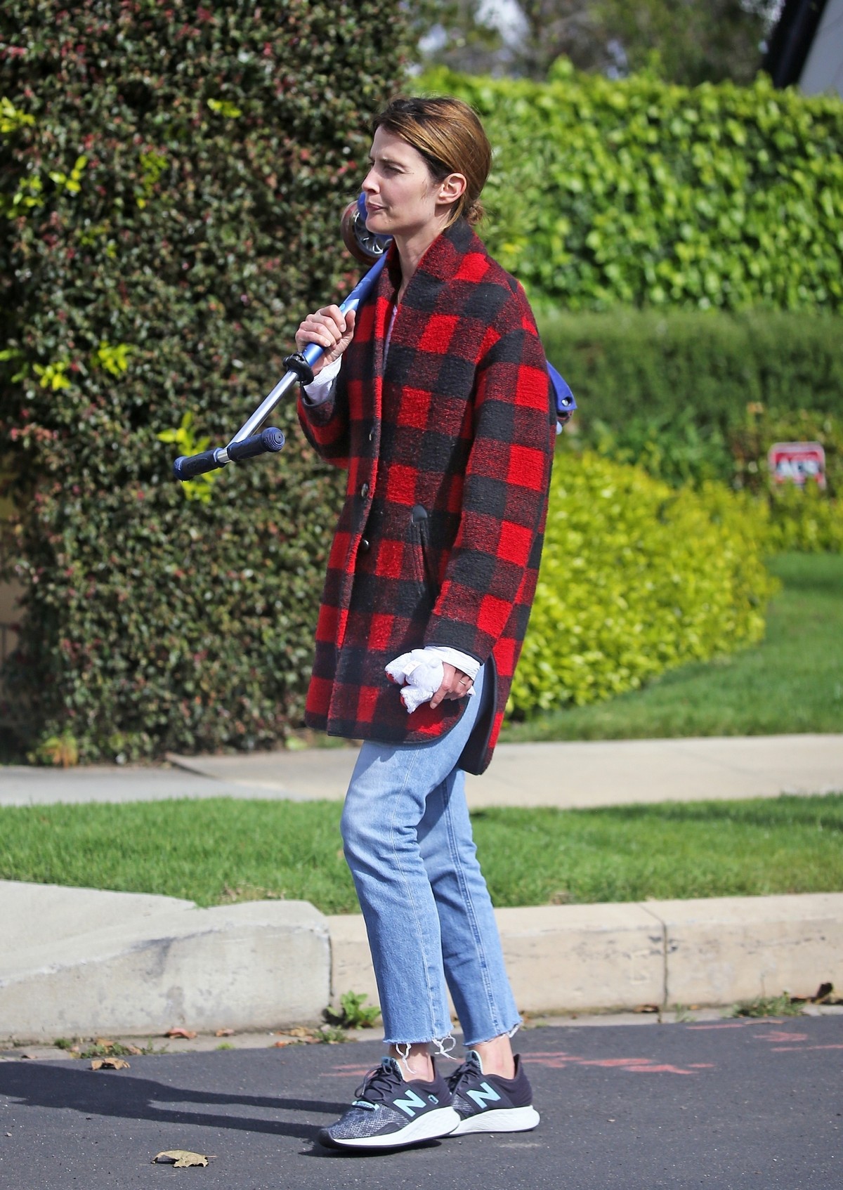 Cobie Smulders seen in red checked shirt with blue denim out in Los Angeles 2020/04/08