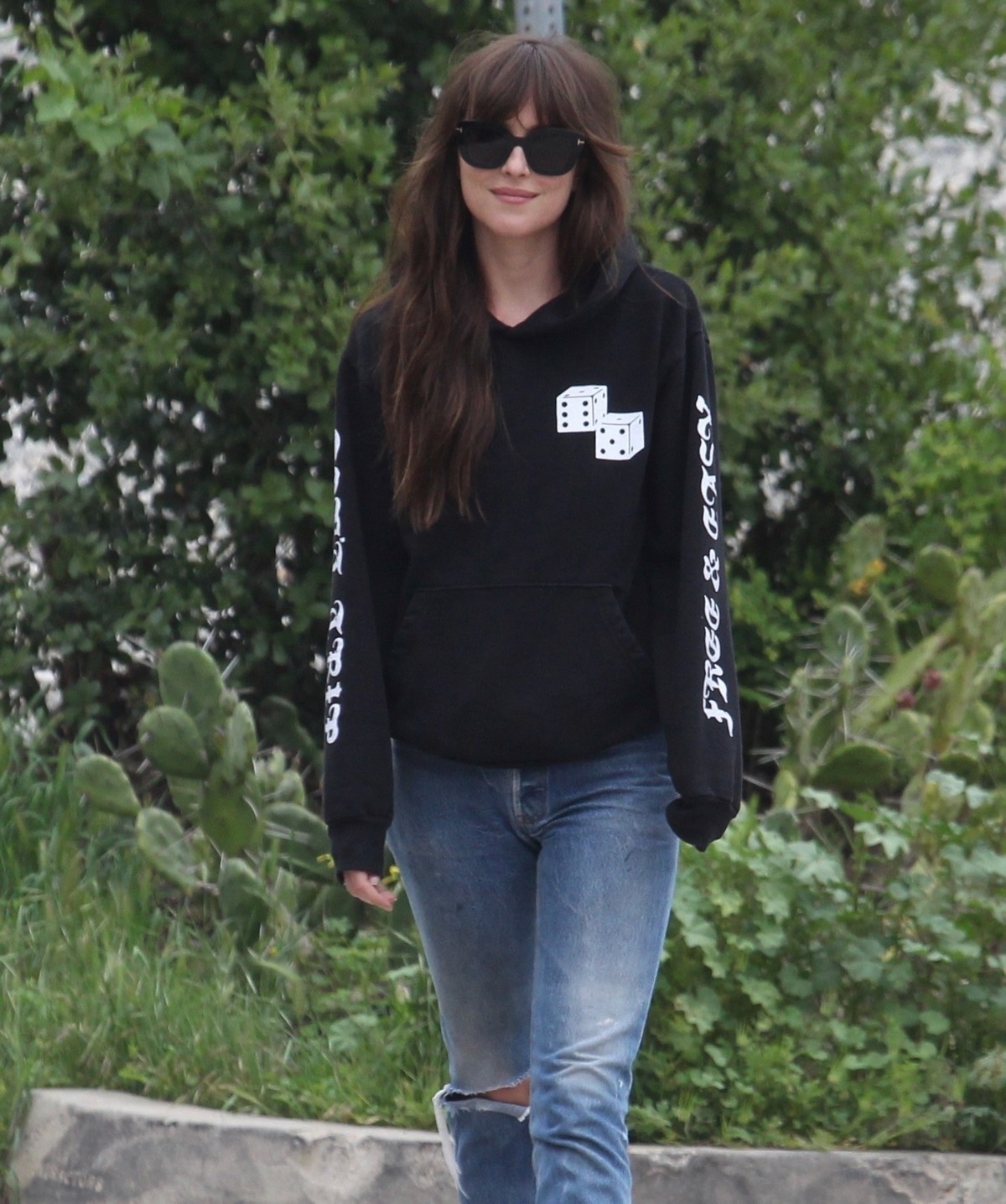 Dakota Johnson seen in black sweatshirt and ankle jeans out in Los Angeles 2020/04/13