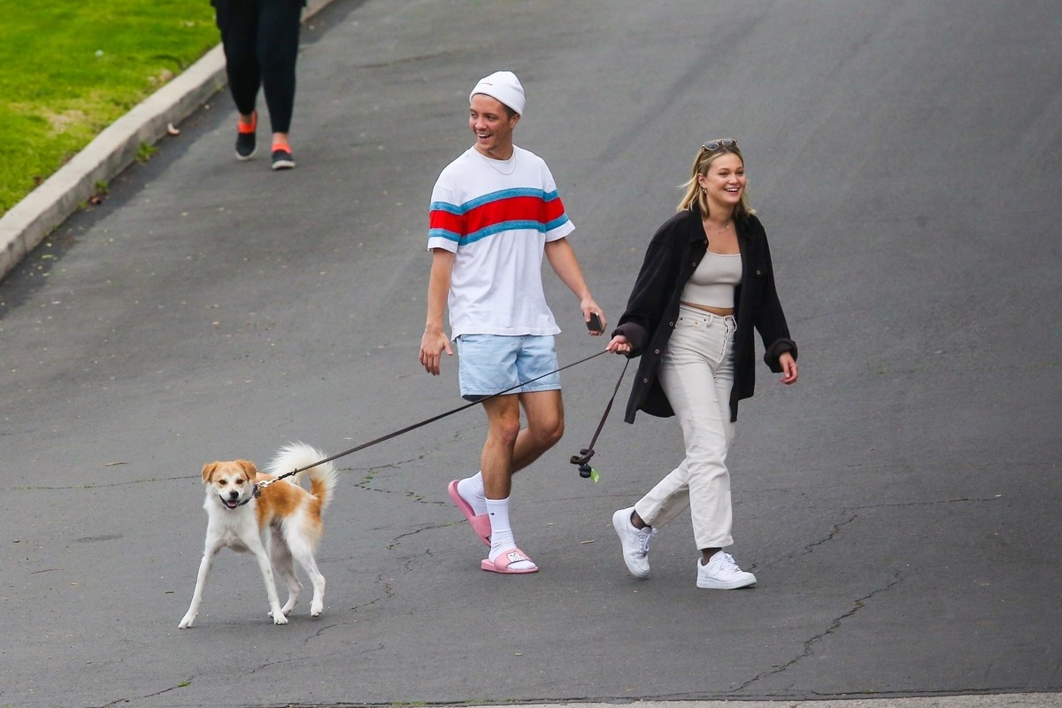 Olivia Holt walks her dog with a friend in Los Angeles 2020/03/31