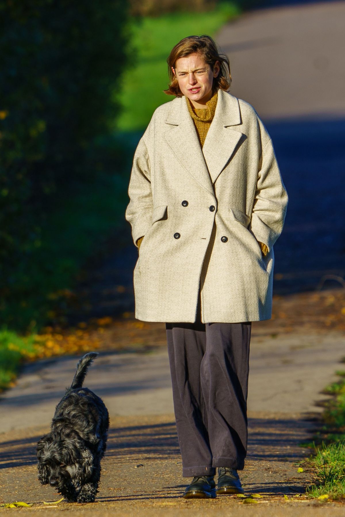 Emma Corrin Out with Her Dog at a Park in London 2020/11/15