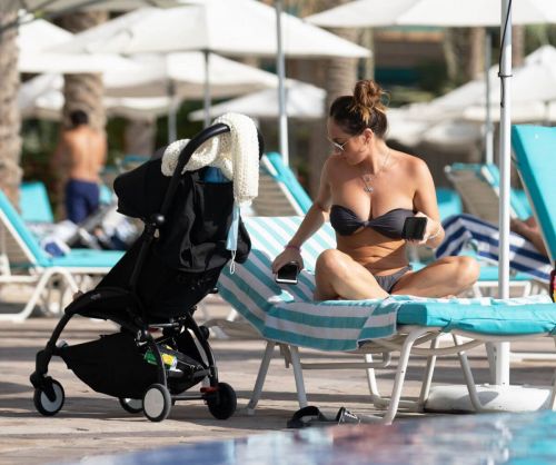 Lauryn Goodman flashes her cleavage in Bikini at a Pool in Dubai 11/26/2020 2