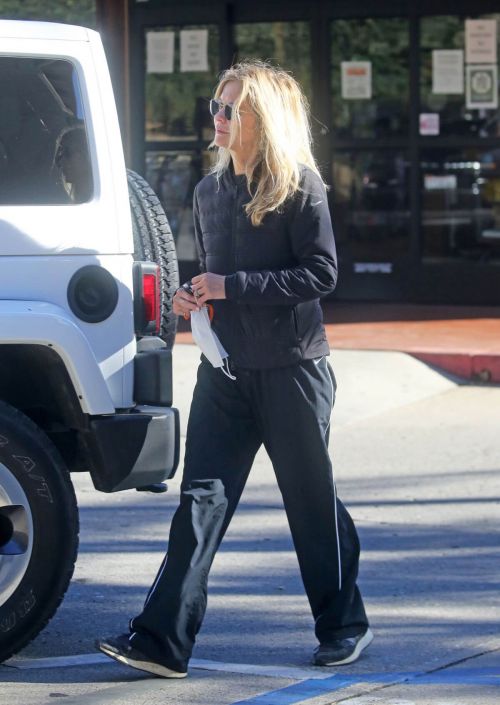 Meg Ryan in Puffer Jacket and Track Paints Out Shopping in Santa Monica 11/24/2020 2