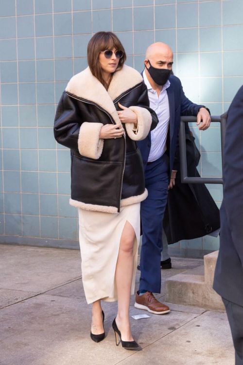 Dakota Johnson in Shearling Jacket and flashes her Legs Day Out in New York 6