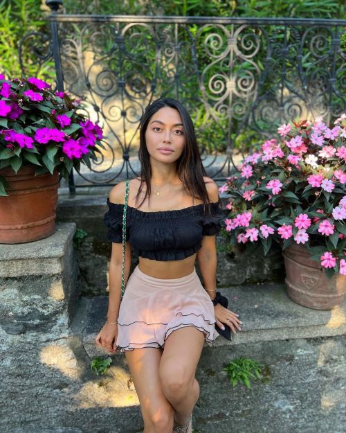 Ambra Gutierrez seen in Off Shoulder Black Frill Top with Light Pink Short Skirt