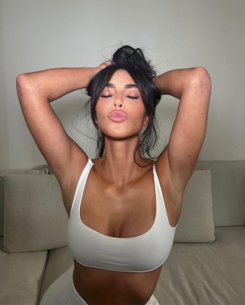 Kim Kardashian Poses in SKIMS White Sportswear
