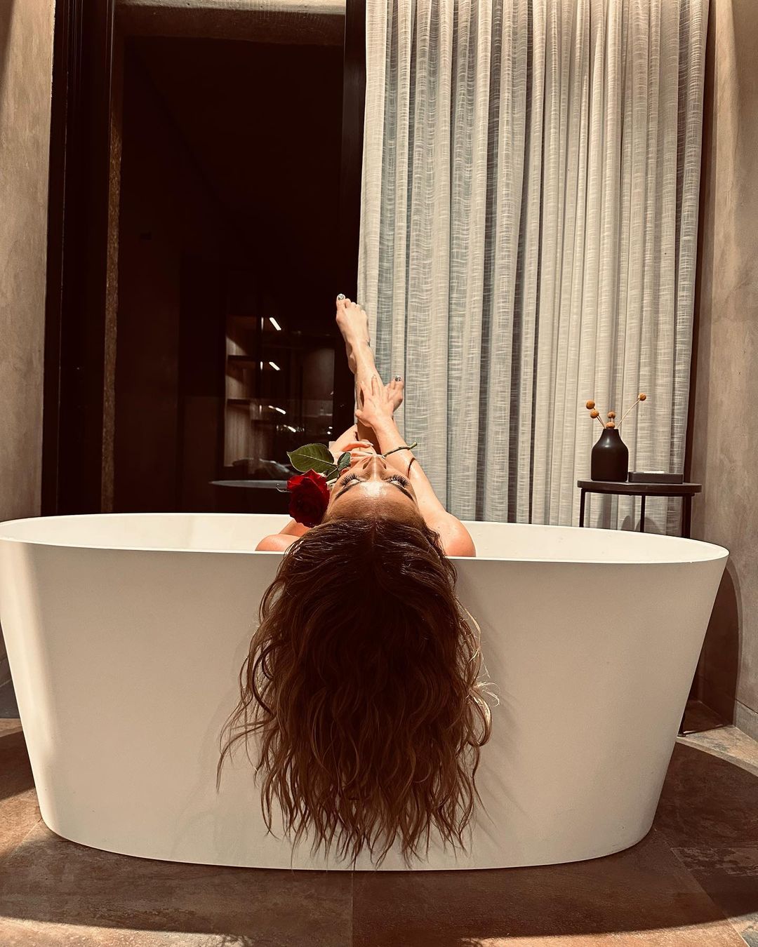 Olga Buzova Poses in Bath Tub with Red Rose during Photoshoot, Feb 2023