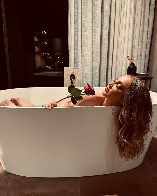 Olga Buzova Poses in Bath Tub with Red Rose during Photoshoot, Feb 2023 2