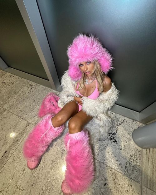 Tallia Storm poses in Tiny Pink Bikini and Fur Coat at Brit Awards 2023 in O2 Arena in London 3