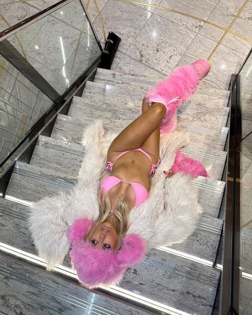 Tallia Storm poses in Tiny Pink Bikini and Fur Coat at Brit Awards 2023 in O2 Arena in London 6