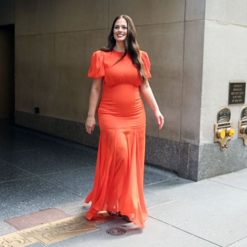 Ashley Graham's Effervescent Charm Shines in an Orange Gown