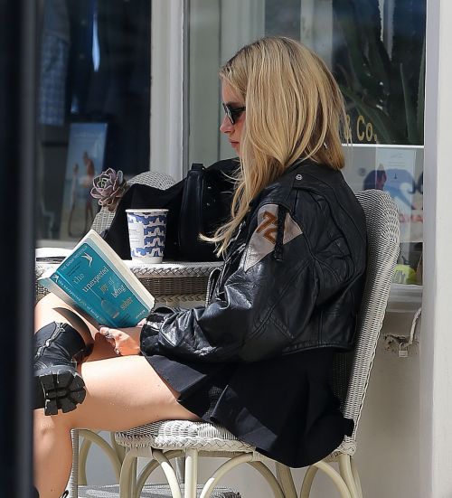 Lottie Moss Out Reading "The Unexpected Joy of Being Sober" by Catherine Gray in London 07/17/2023 2