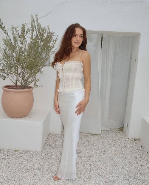 Enchanting Oana Gregory shines in a House of CB white dress, exuding grace and charm in her Instagram photos