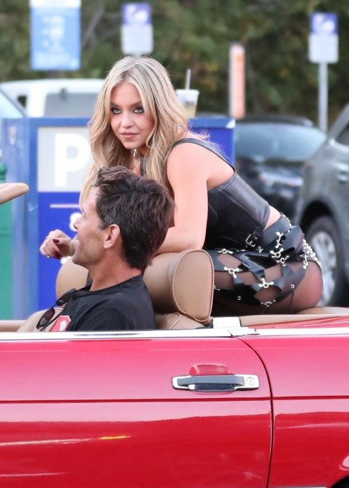 Sydney Sweeney Cruises Sunset Blvd in a Classic Convertible Mercedes-Benz at a Photoshoot in Los Angeles 07/22/2023 6