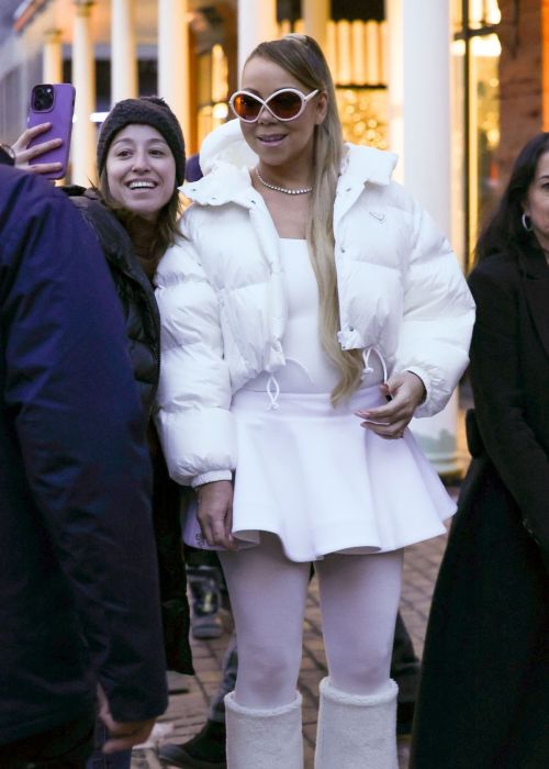 Mariah Carey in White Puffer Jacket and Dress in Aspen 5