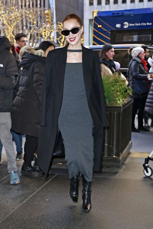 Phoebe Dynevor in Long Overcoat and Charcoal Dress During Outing in New York