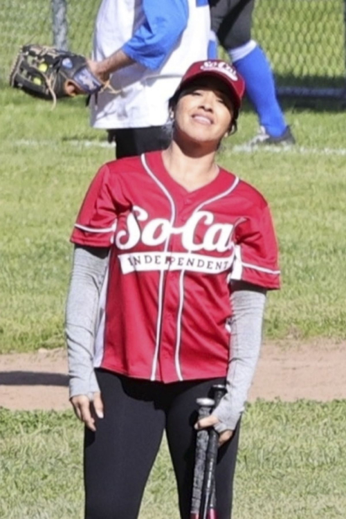 Gina Rodriguez on Set Dressed in a Baseball Uniform in Los Angeles, February 2024