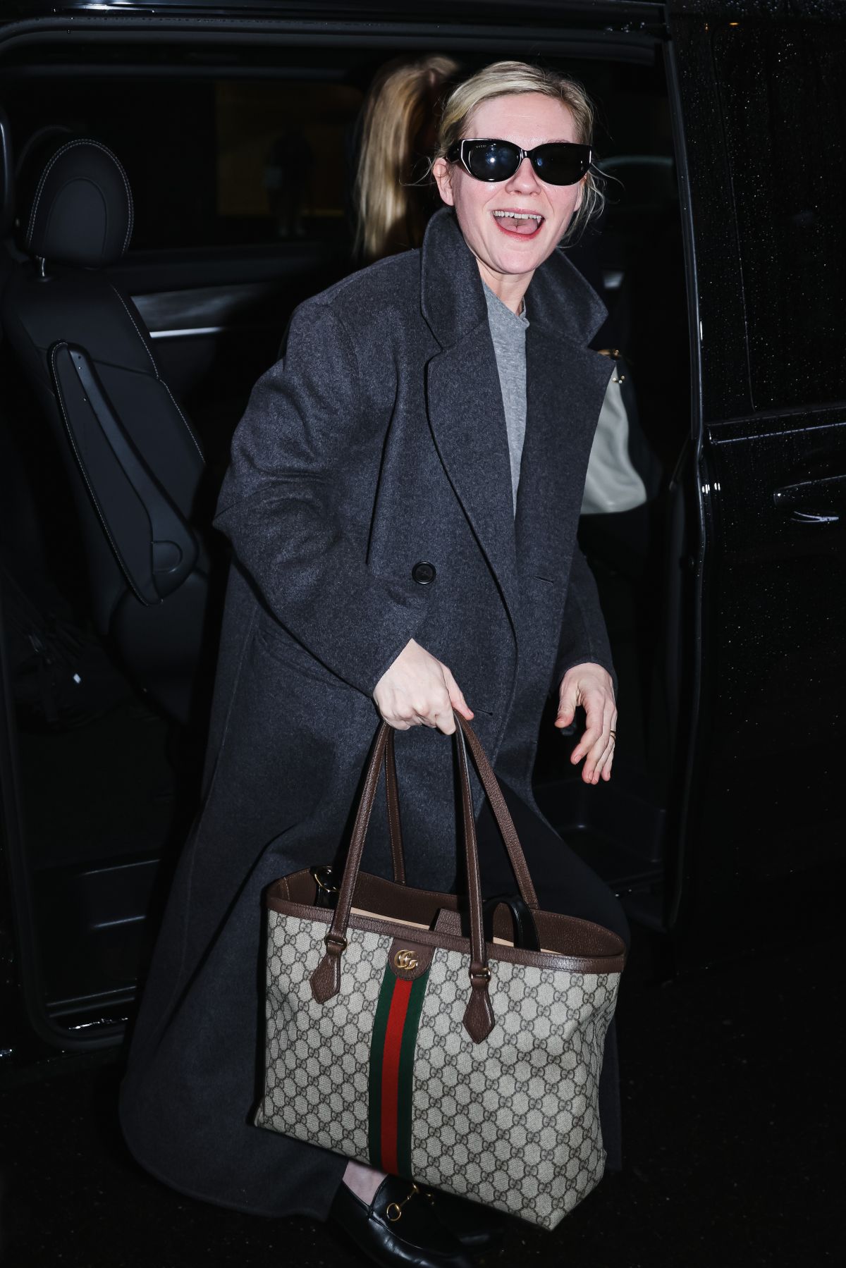 Kirsten Dunst Arrives at Gucci Show at Milan Fashion Week, February 2024